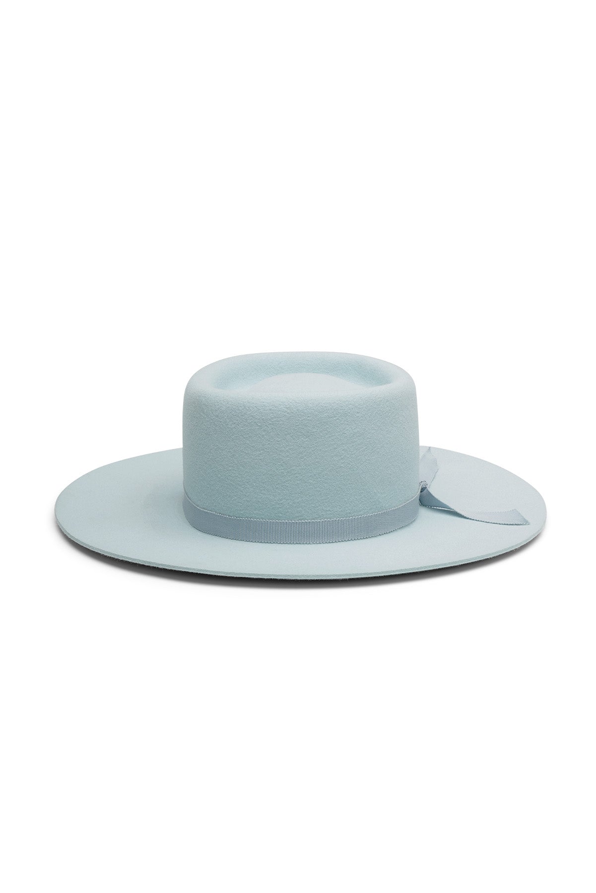 Sky blue fur felt bolero style hat with a round telescope crease, flat brim, and tonal grosgrain ribbon. Unisex hat style in various sizes and colors. We ship worldwide. Shop now. Each SoonNoon hat is handmade with unique character in Stockholm, Sweden.
