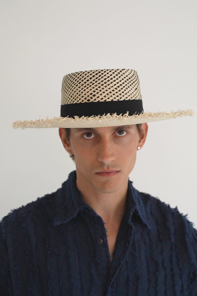 Natural/black pattern straw bolero style hat with a wide frayed brim, grosgrain ribbon and telescope crown. Unisex hat style in various sizes and colors. We ship worldwide. Shop now. Each SoonNoon hat is handmade with unique character in Stockholm, Sweden.