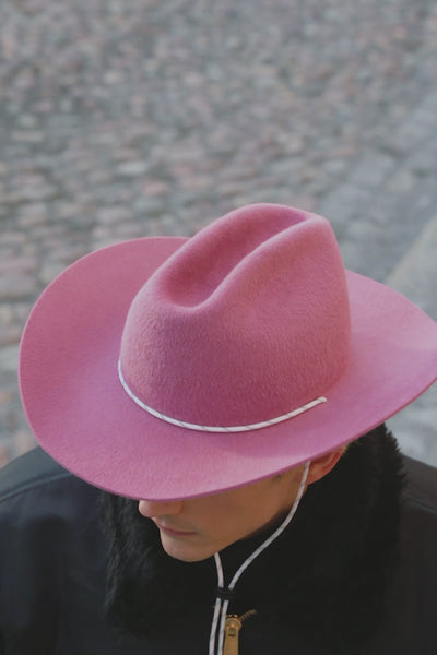 Unisex pink fur felt cowboy hat with a wide brim and center crease, handcrafted by SoonNoon in Stockholm