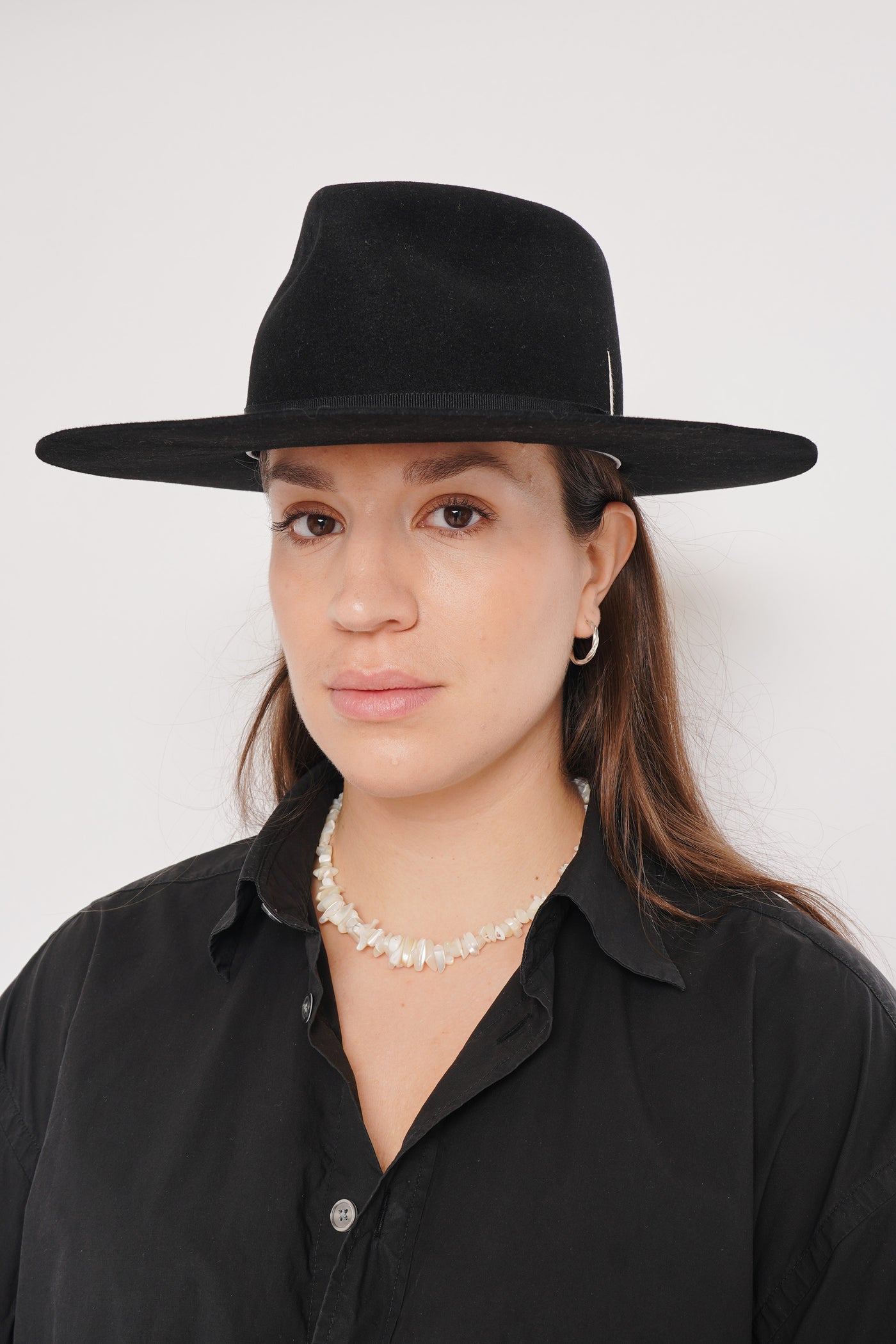 Unisex black fur felt fedora hat with a wide brim, black ribbon and tear drop crown, handcrafted by SoonNoon in Stockholm