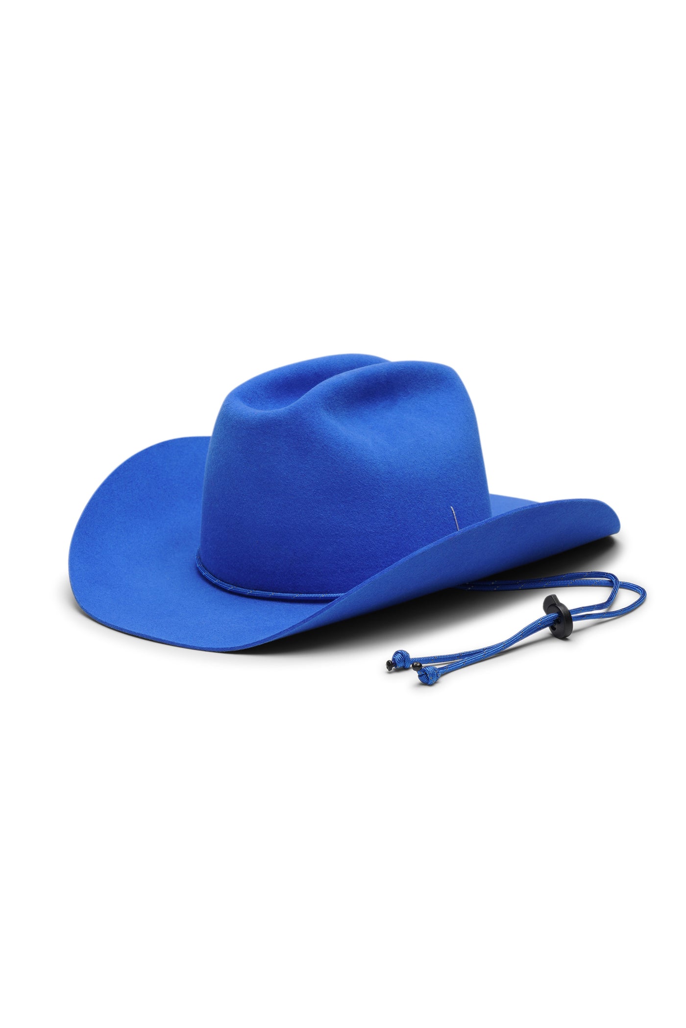 Blue cowboy 100% fur felt hat with a wide brim and center crease. Paracord chin strap detail in blue and reflective. Unisex hat style in various sizes and colors. We ship worldwide. Shop now. Each SoonNoon hat is handmade with unique character in Stockholm, Sweden.